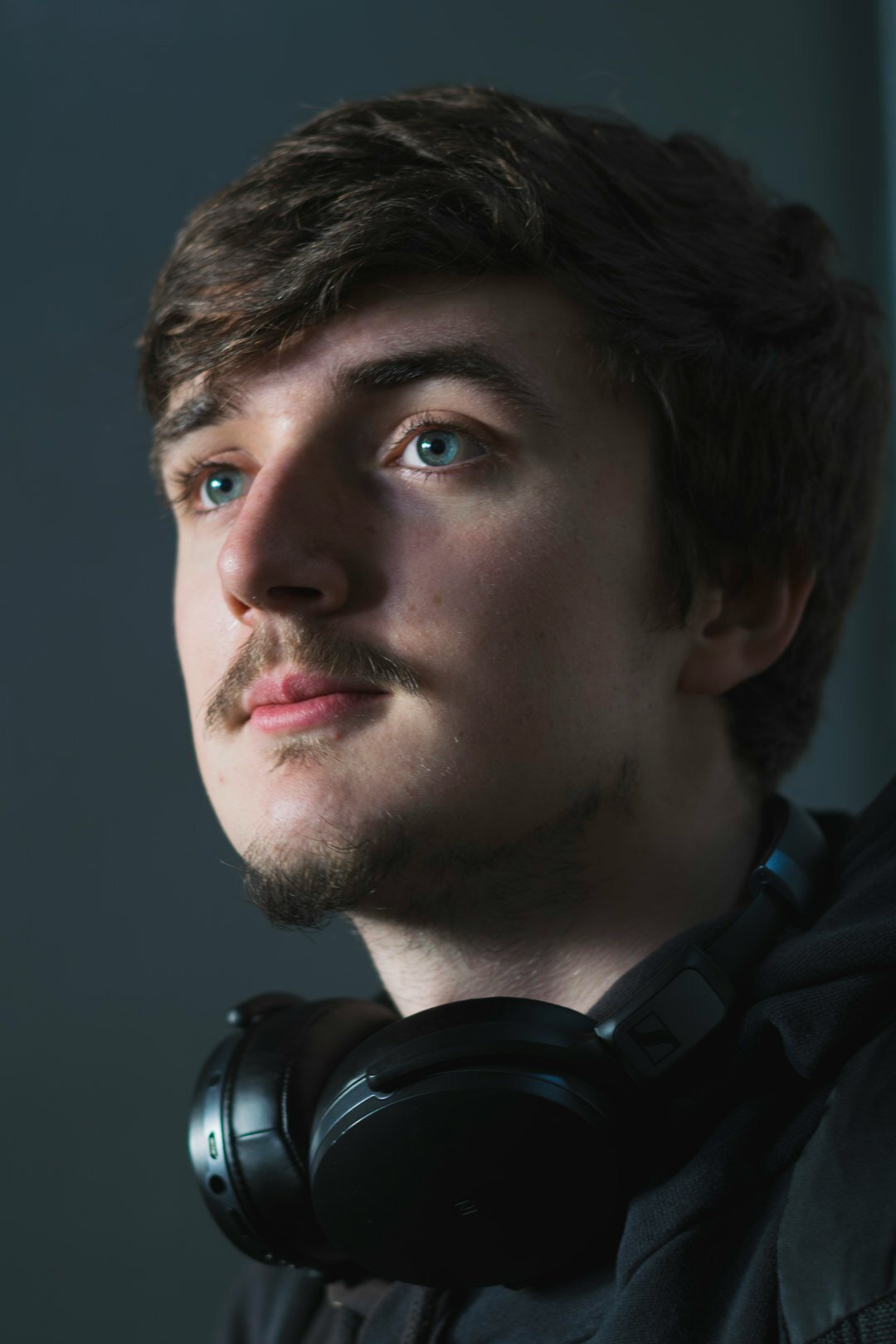 Studio portrait of a Nordic man camera operator with headset